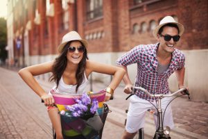Couple riding bicycles in the city